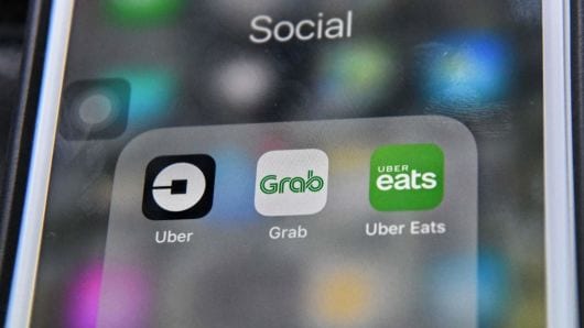 KPPU Singapura Ancam Denda Grab dan Uber
