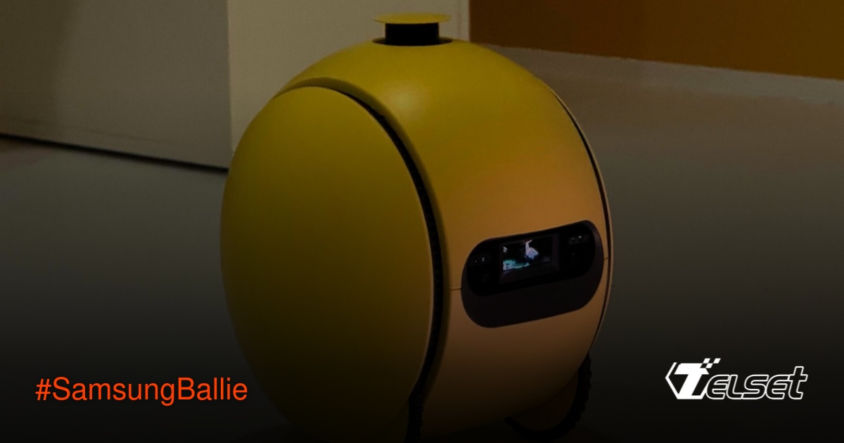 Robot AI Samsung Ballie berwarna kuning sedang memproyeksikan gambar di lantai rumah