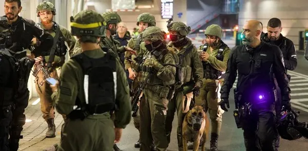 Security and rescue personnel take cover in public shelter following missile attack from Iran on Israel, at Tel Aviv, Israel June 13, 2025