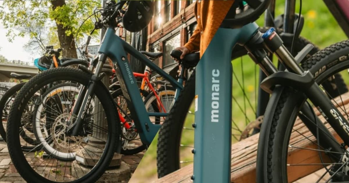 Monarc Tracer e-bike komuter dual baterai tampak depan dengan latar jalan perkotaan