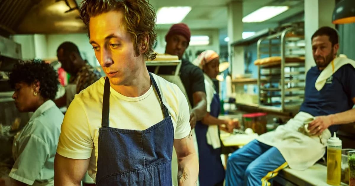 "The Bear's Carmen Berzatto stares worryingly at an unseen dish as his kitchen staff busies themselves in preparation."