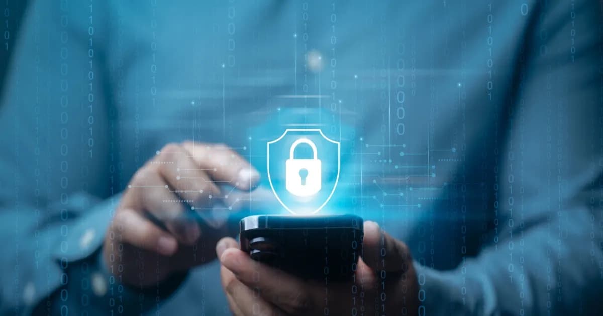 Man holding a smartphone with a lock icon floating above it