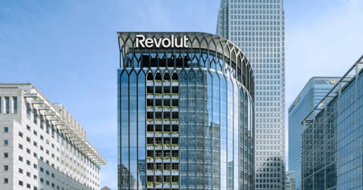 Revolut logo displayed on a smartphone screen with a security warning symbol overlay