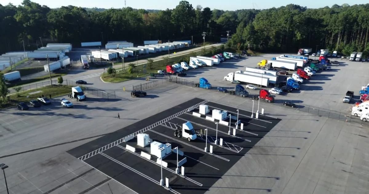 Aerial view of a Tesla Semi Megacharger site in Georgia with a Semi tractor parked at a stall