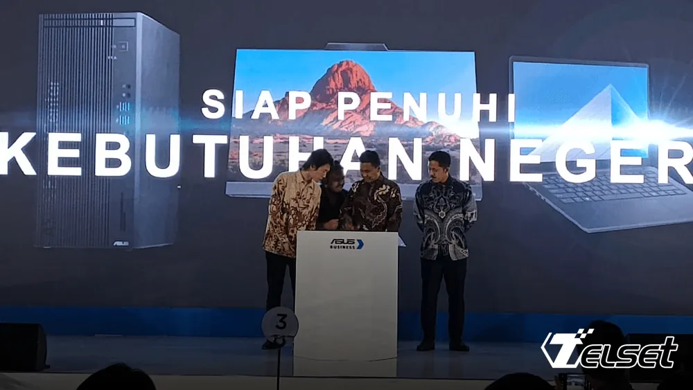 ASUS ExpertBook laptop untuk sektor pemerintahan di atas meja kerja dengan latar belakang grafik pertumbuhan pasar