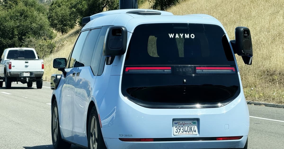 Waymo autonomous Zeekr electric robotaxi driving along California highway
