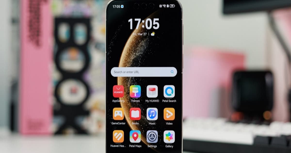 Huawei Mate 80 Pro upright on a table with its display showing the home screen.