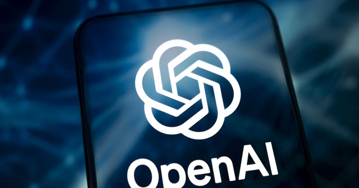 Logo OpenAI dan nama perusahaan ditampilkan di ponsel dengan latar belakang biru