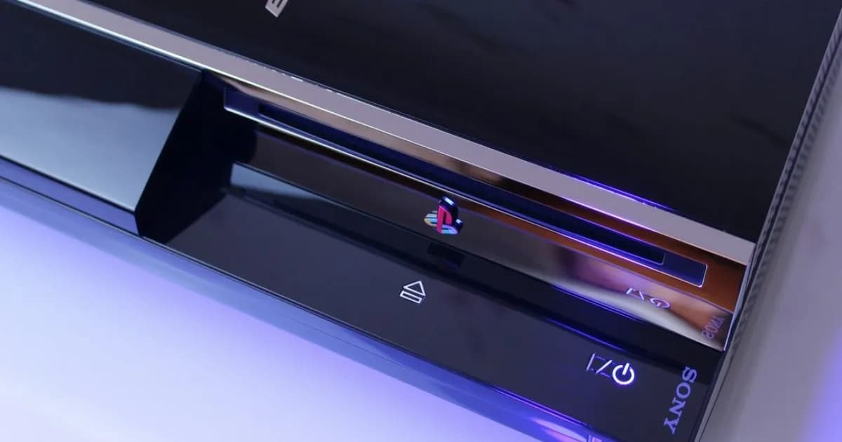 Sony PS Vita console on a wooden surface with game cartridges