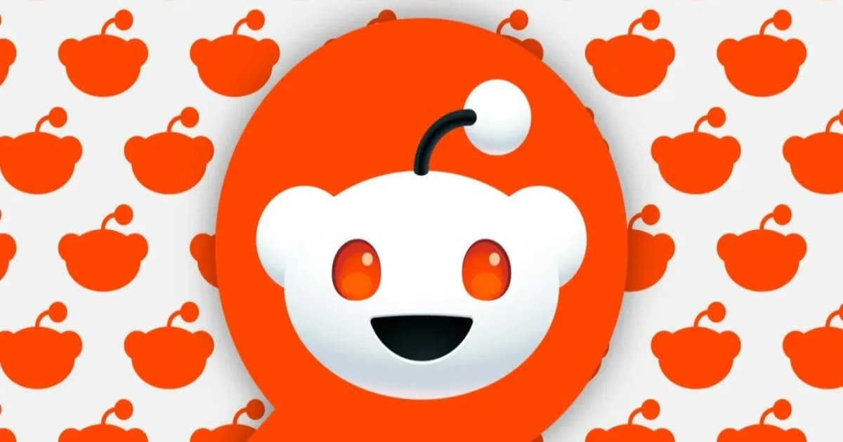Ilustrasi logo Reddit dengan grafik saham menurun di latar belakang.