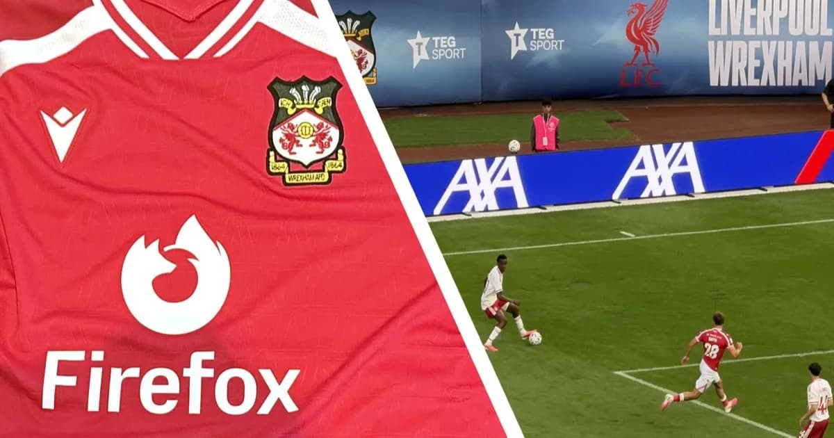 Firefox flame logo on red Wrexham AFC jersey with Yankee Stadium background