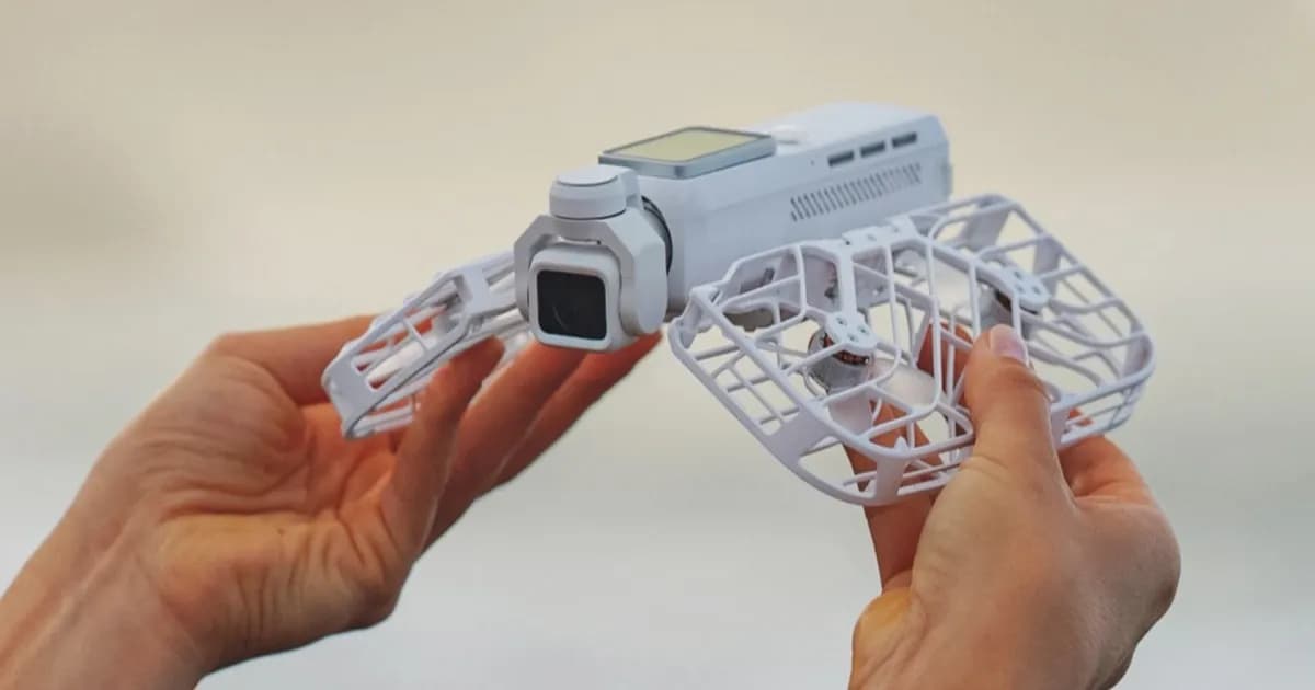 HoverAir Versa 2-in-1 pocket gimbal camera and drone taking off from a person's hand in white