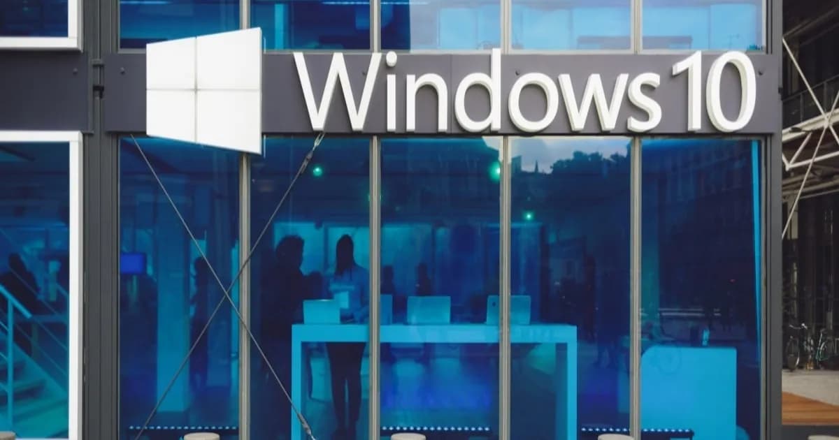 Ilustrasi logo Windows 10 dengan latar pembaruan keamanan dan ikon perlindungan siber