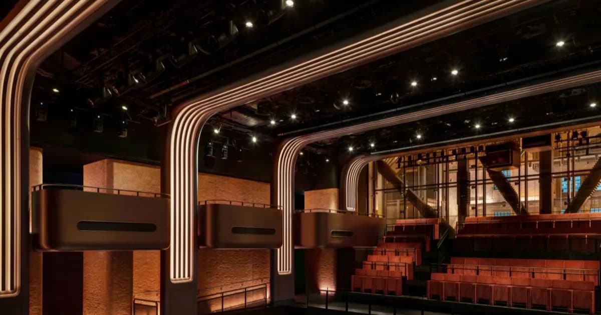 A glimpse at the Apple Music Hall, showing its chairs and boxes.