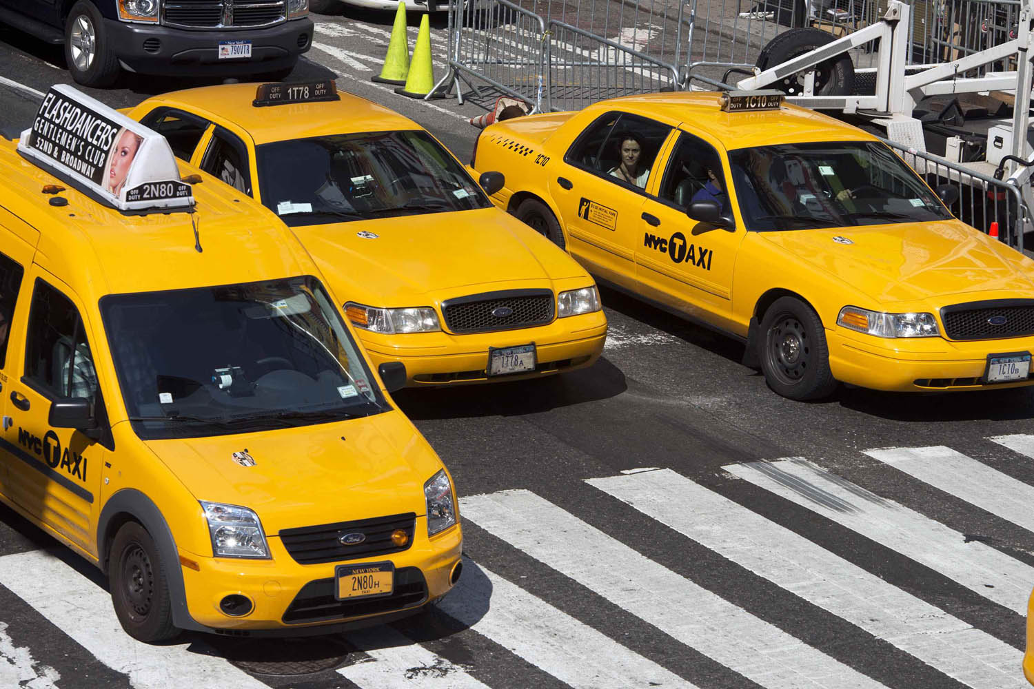 New York City taxis make their way through Times Square in New York