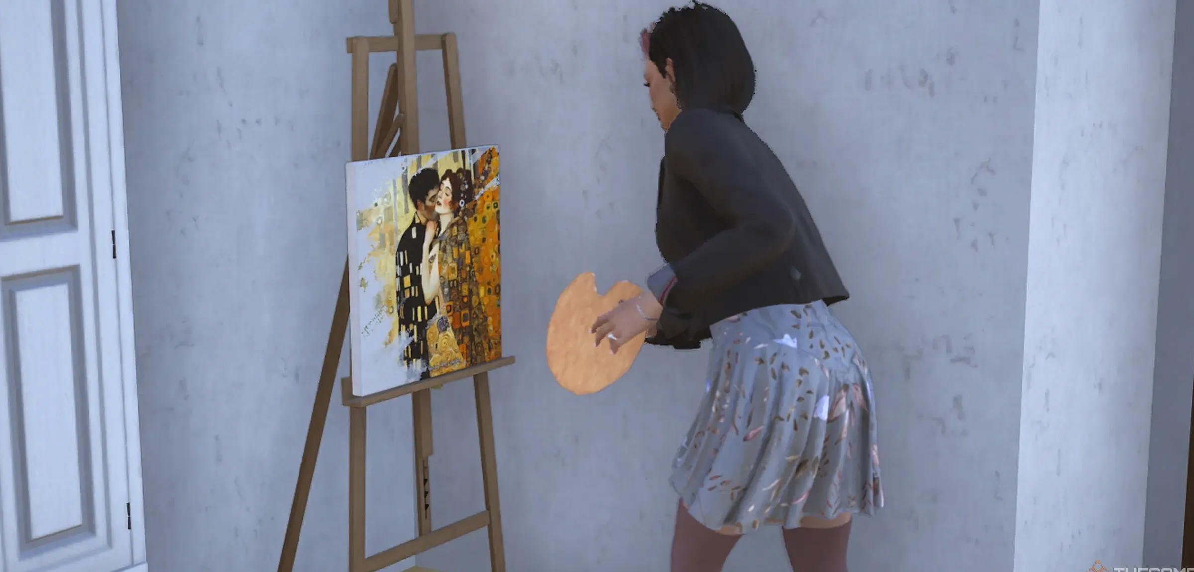 A woman painting a yellow portrait of lovers in her home.