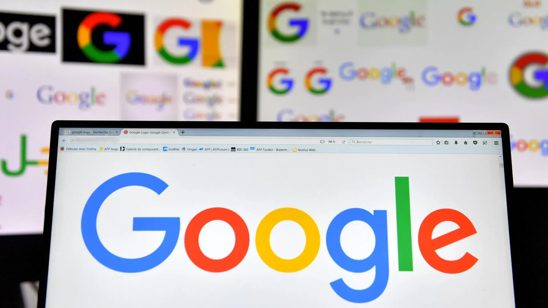 Google logos displayed on several screens