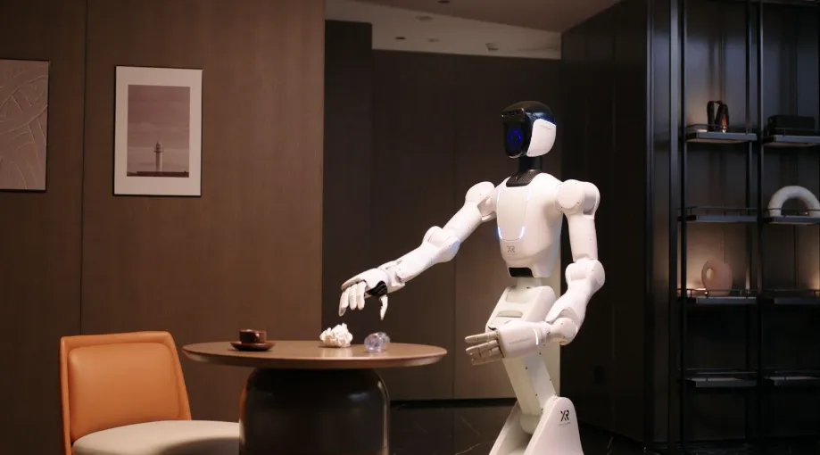 Ilustrasi robot Quanta X2 dengan lengan robotik yang sedang melakukan tugas rumah tangga