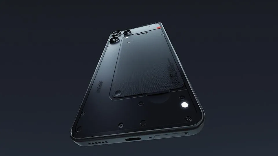 Dramatic view of the Nothing Phone 3a Lite smartphone. Its notification LED is lit, as the black phone floats against a dark background.